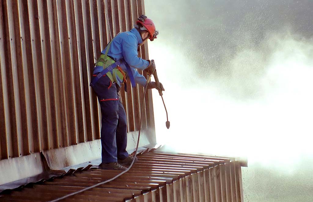 Operated Access with cherry picker hire for industrial cladding cleaning